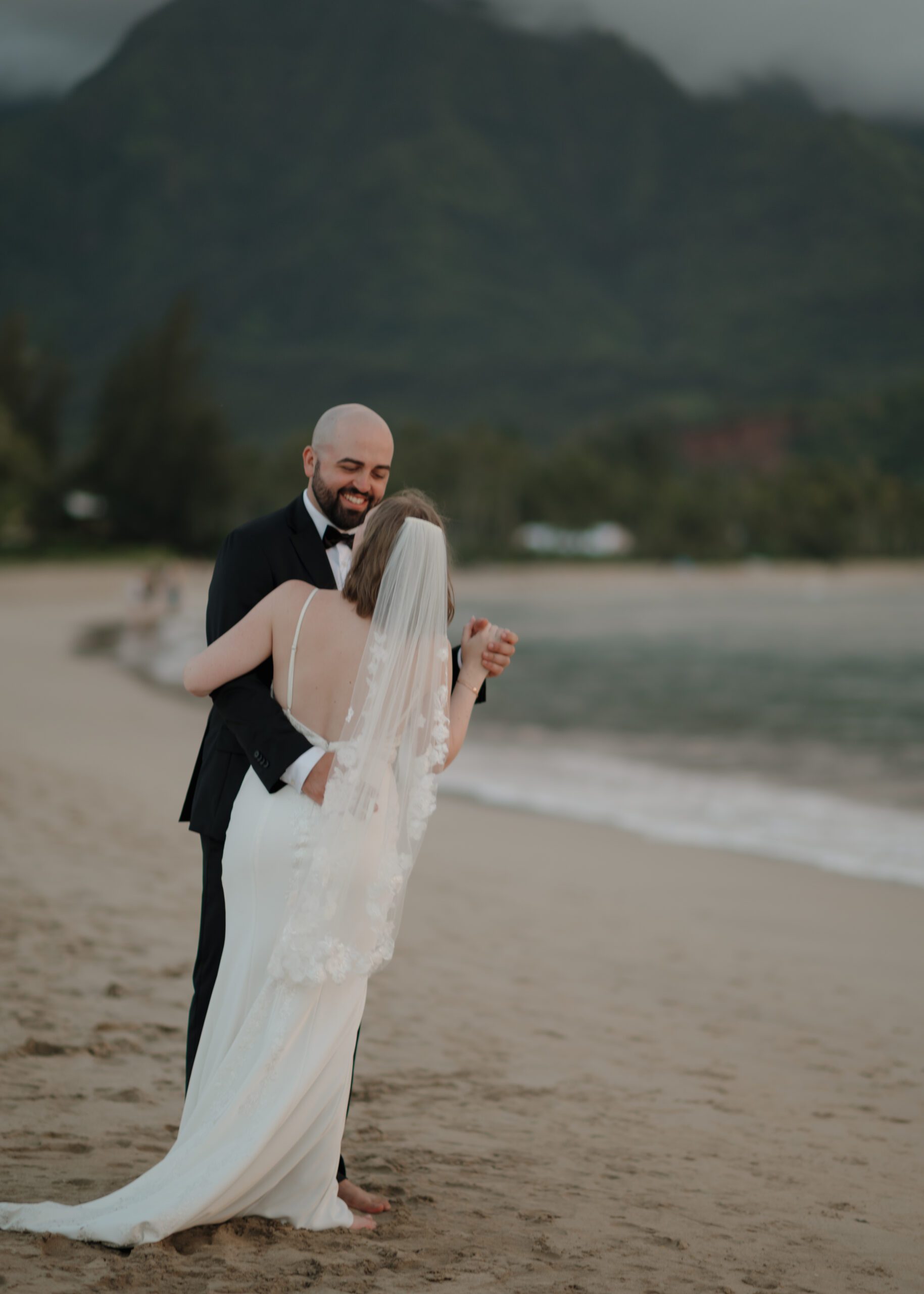 couple dancing on the beach during their beach elopement