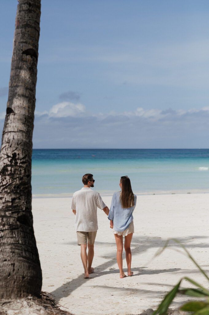 couple relaxing during their beach wedding vacation
