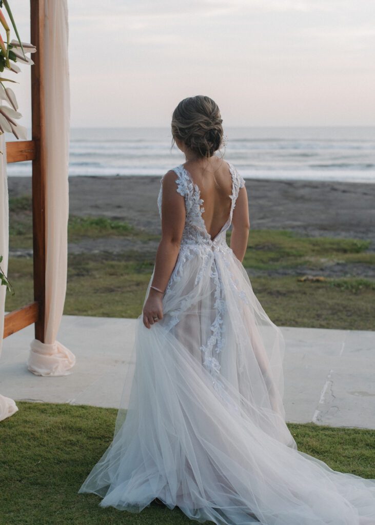 bride overlooking beach in bali during elopement
