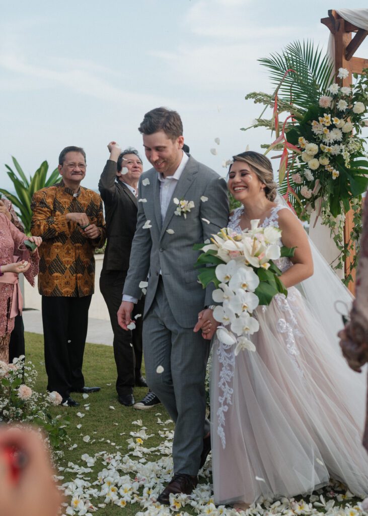 couple walking down aisle during bali beach wedding