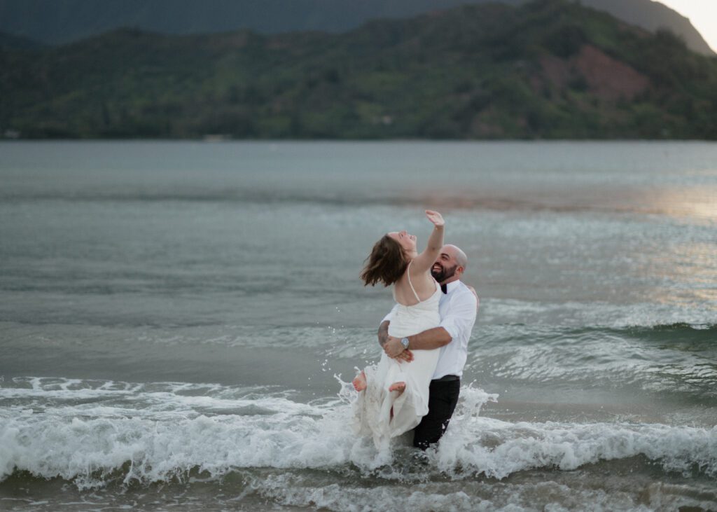 canadian couple in the water during their beach elopement in hawaii
