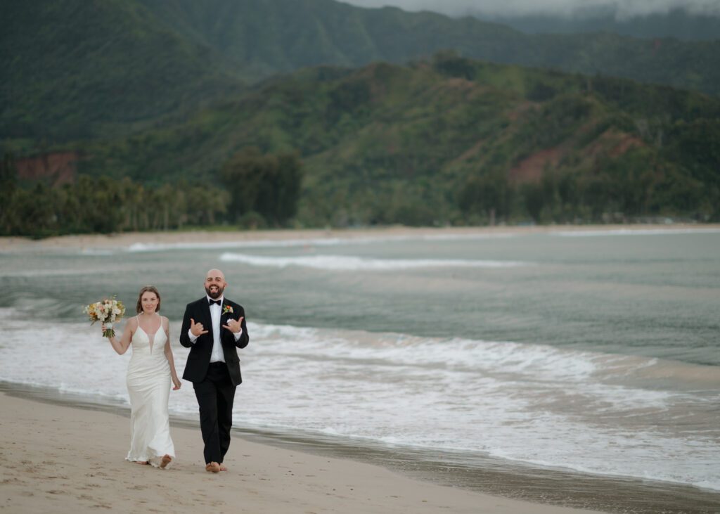 canadian couple walking on beach during their destination beach elopement