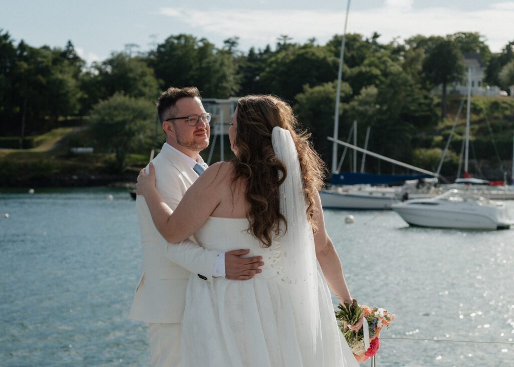 couple on a sailboat during their elopement in halifax